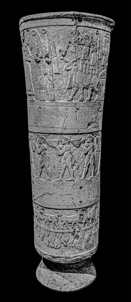 Ancient alabaster vase from Uruk, Mesopotamia, decorated with detailed relief carvings of religious and agricultural scenes in horizontal bands. Warka, Iraq. 